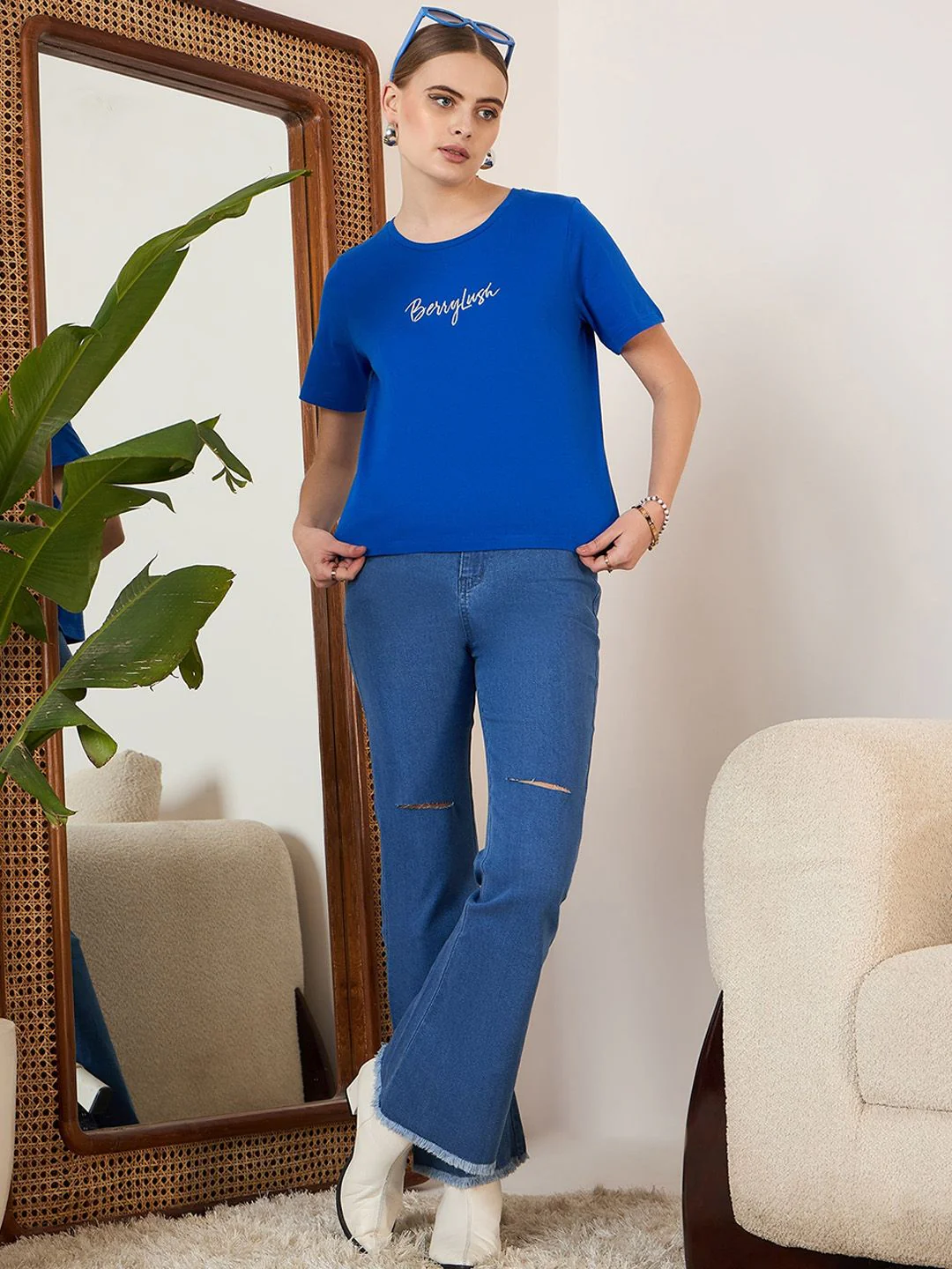 Berrylush Blue Women Bootcut High-Rise Mildly Distressed Stretchable Light Fade Jeans - Image 5