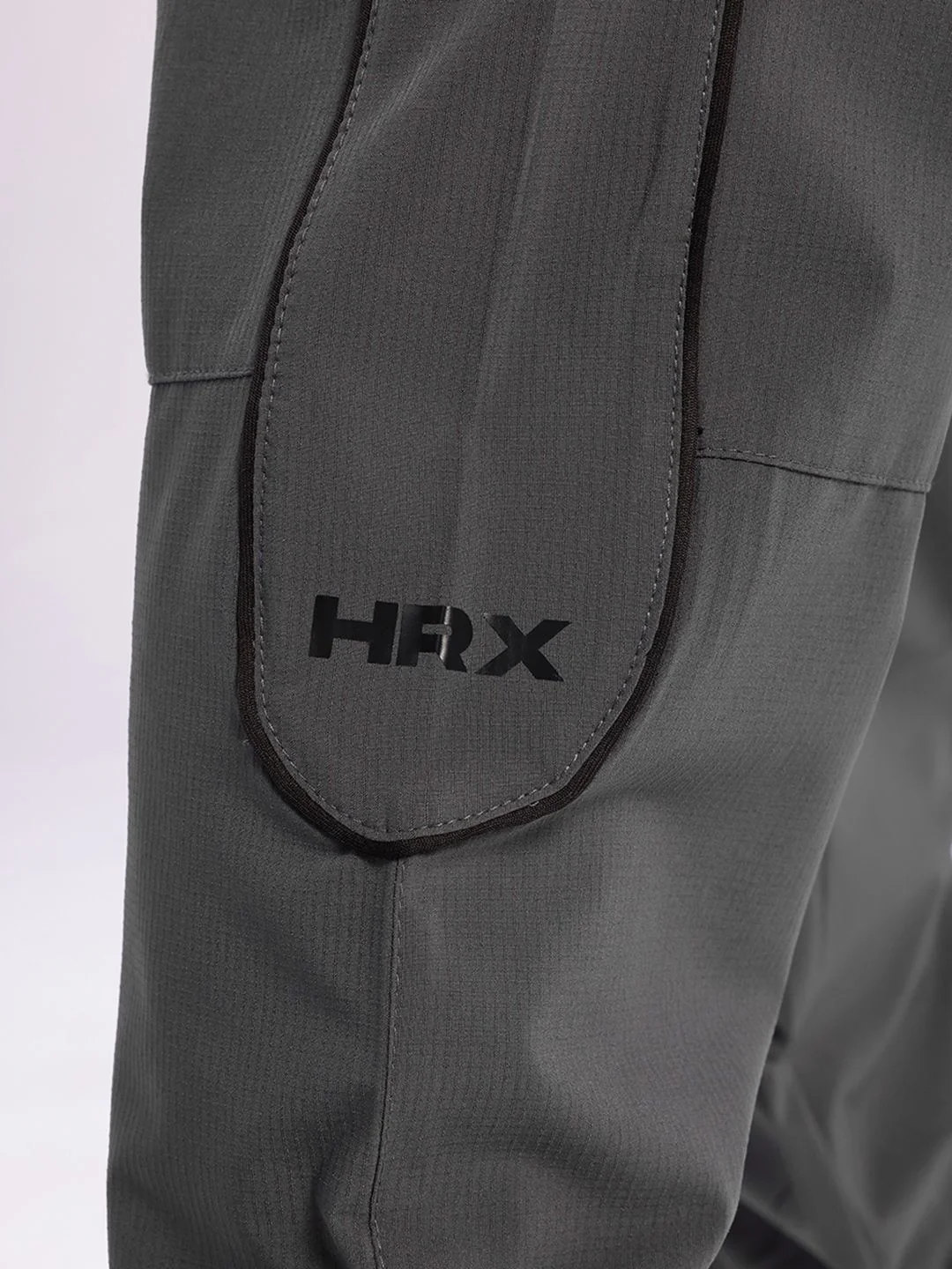 HRX by Hrithik Roshan Men Mid-Rise Rapid-Dry Paneled Lifestyle Joggers - Image 7